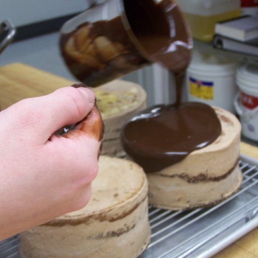Pouring Ganache on the tortes