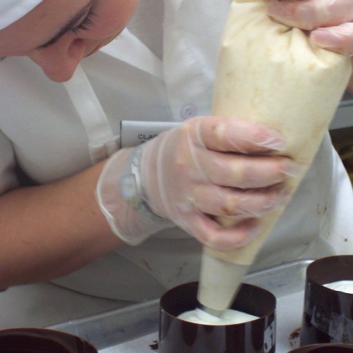 Piping white chocolate mouse into the finished columns