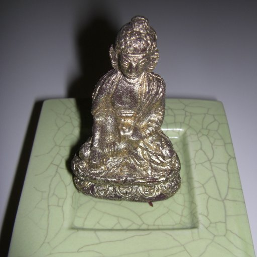 Gold-covered dark chocolate Buddha