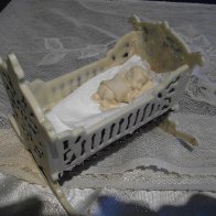 white chocolate cradle with sleeping baby